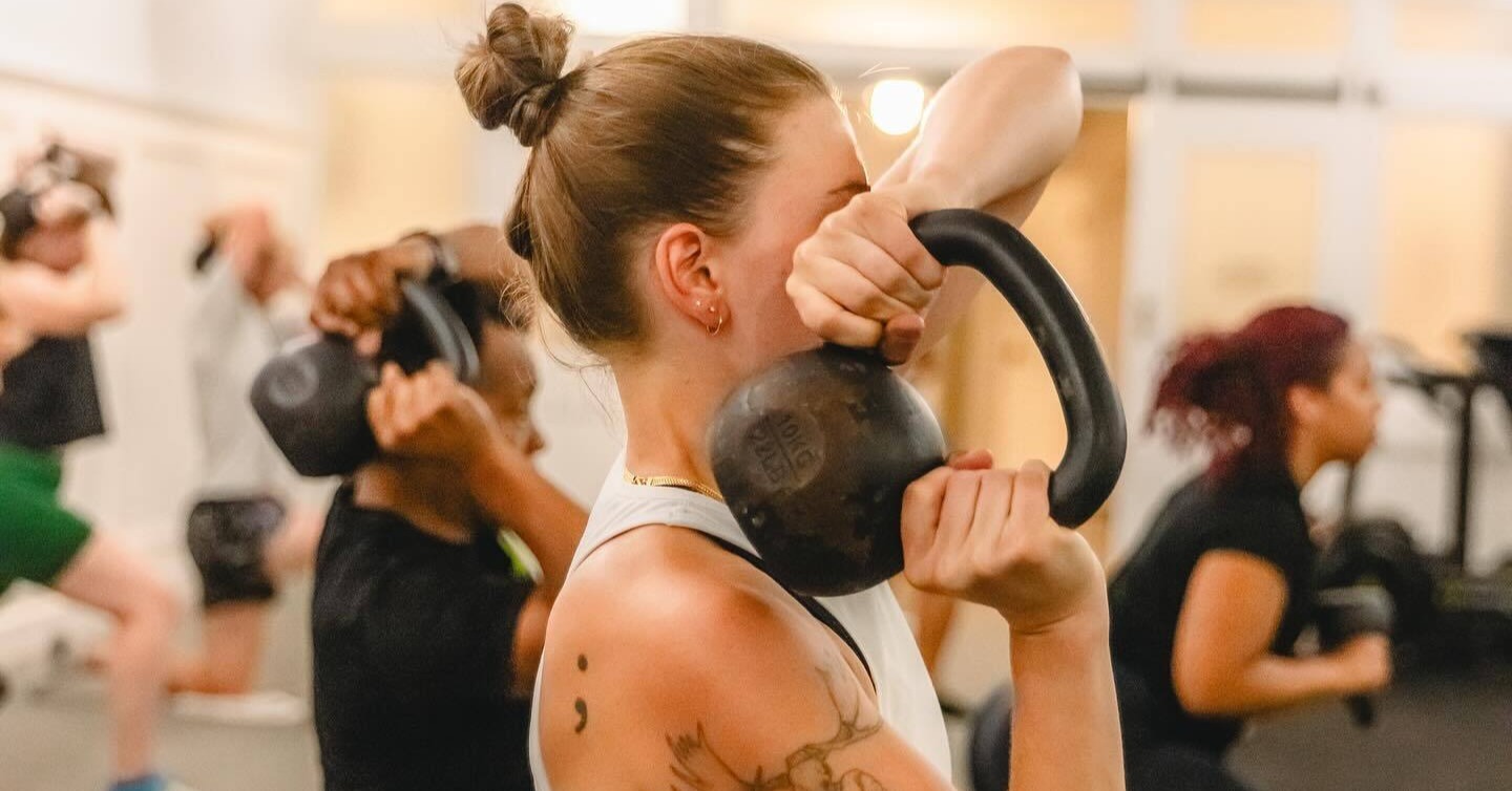 Athlete performing shoulder strengthening exercise during physical therapy session at MOTIVNY in NYC